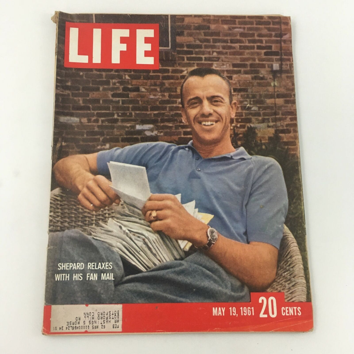Vintage Life Magazine cover from May 19, 1961, featuring astronaut Alan Shepard relaxing with his fan mail, showcasing the excitement of the early space race.