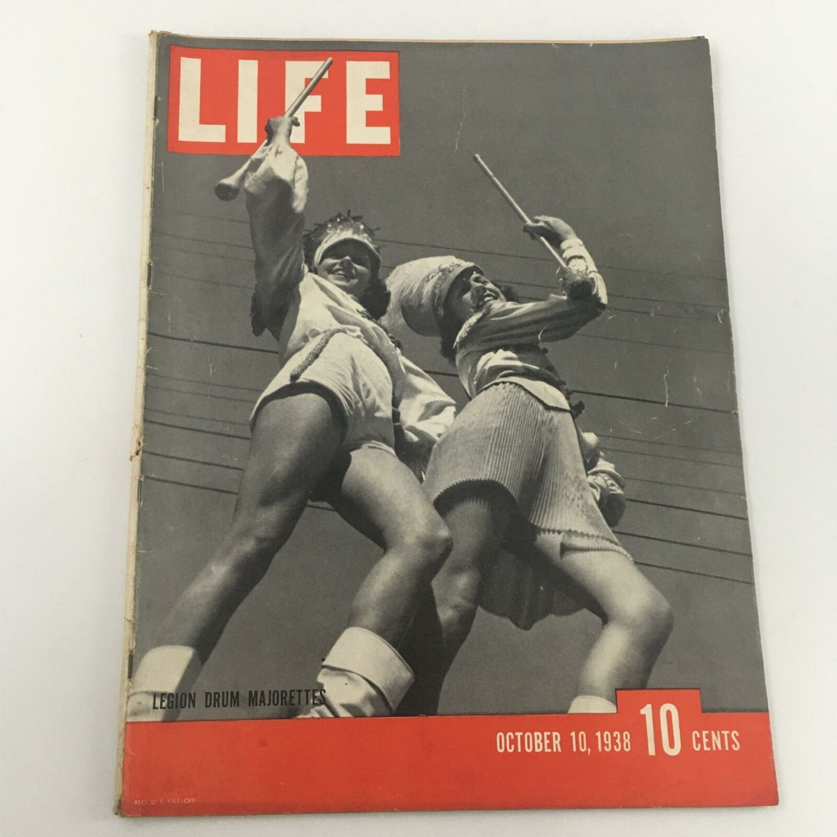 Vintage Life Magazine from October 10, 1938 featuring the cover image of Legion Drum Majorettes, showcasing their stylish outfits and performance. Perfect for collectors and history enthusiasts.