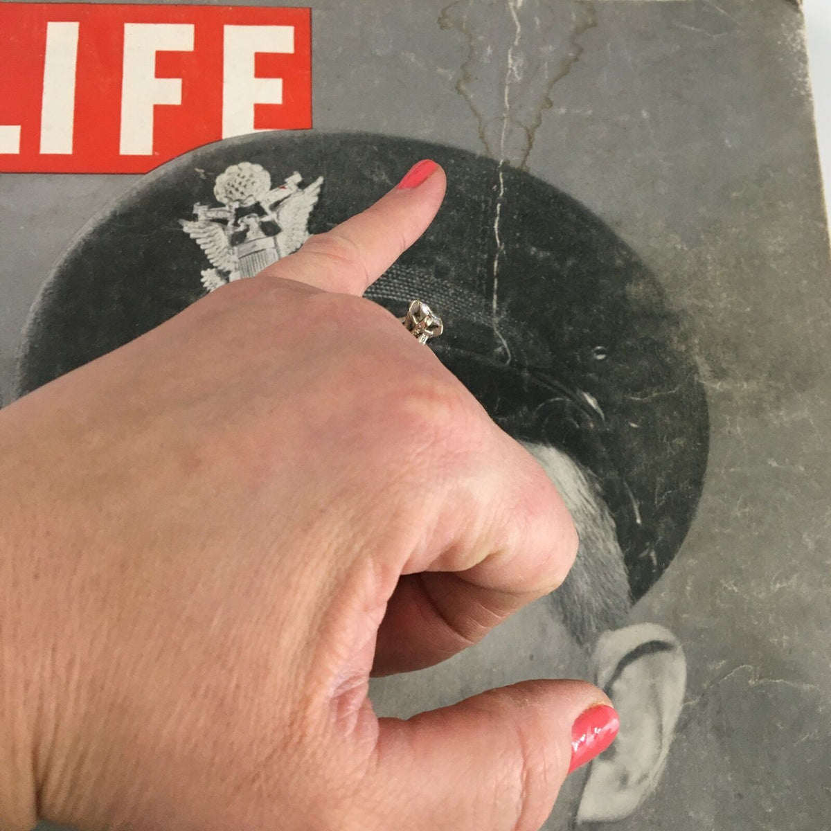 Close-up of VTG Life Magazine April 13 1942 featuring General Brehon B. Somervell with a hand pointing at the cover details.