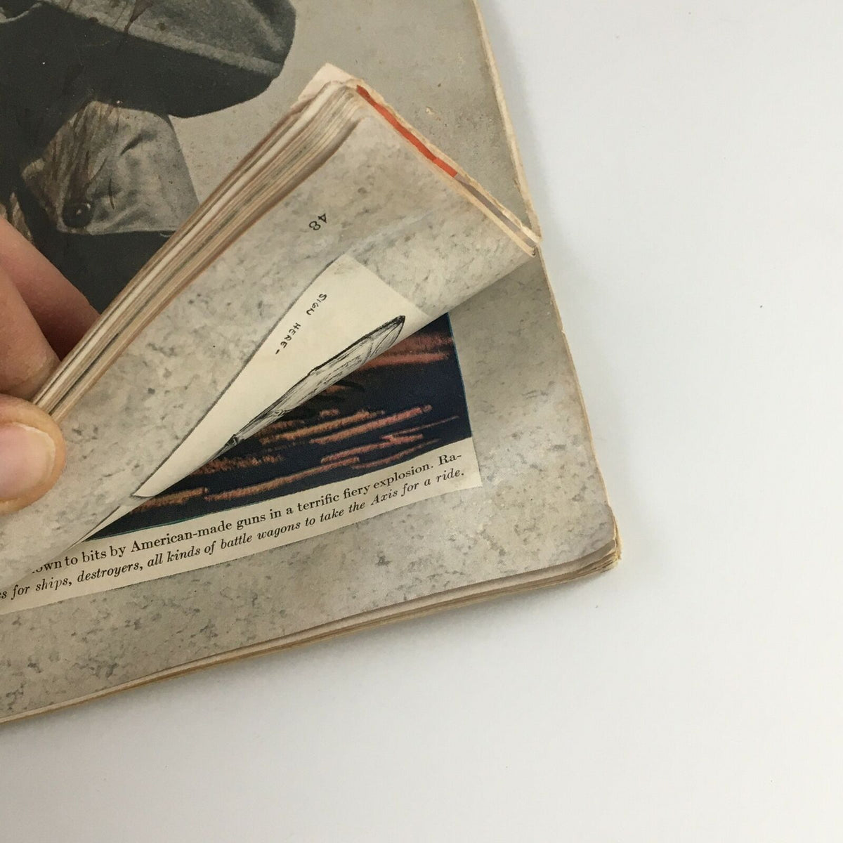 Interior view of vintage Life Magazine from March 16, 1942, showing the pages with potential wear and loose photographs.