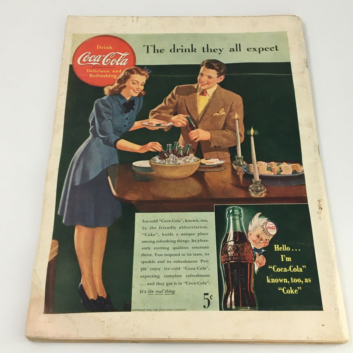 Back cover of vintage Life Magazine showcasing a Coca-Cola advertisement, highlighting mid-20th century design elements.