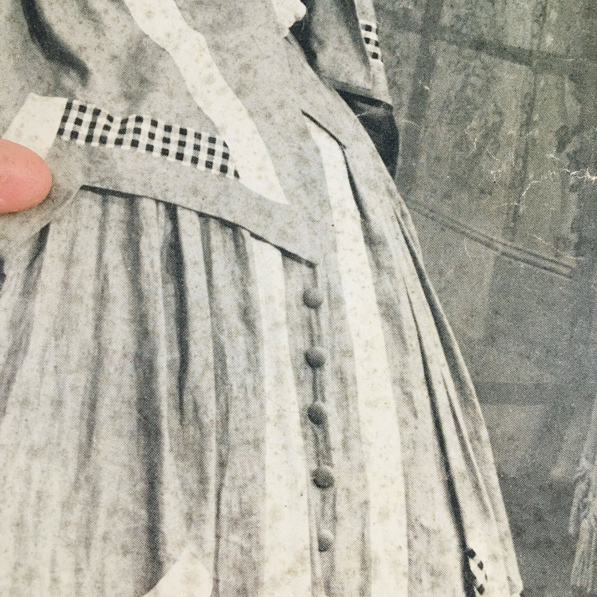 Close-up of the vintage Life Magazine from November 6, 1944 featuring Broadway hit 'Bloomer Girl', showcasing the intricate details of the dress with checkered patterns.