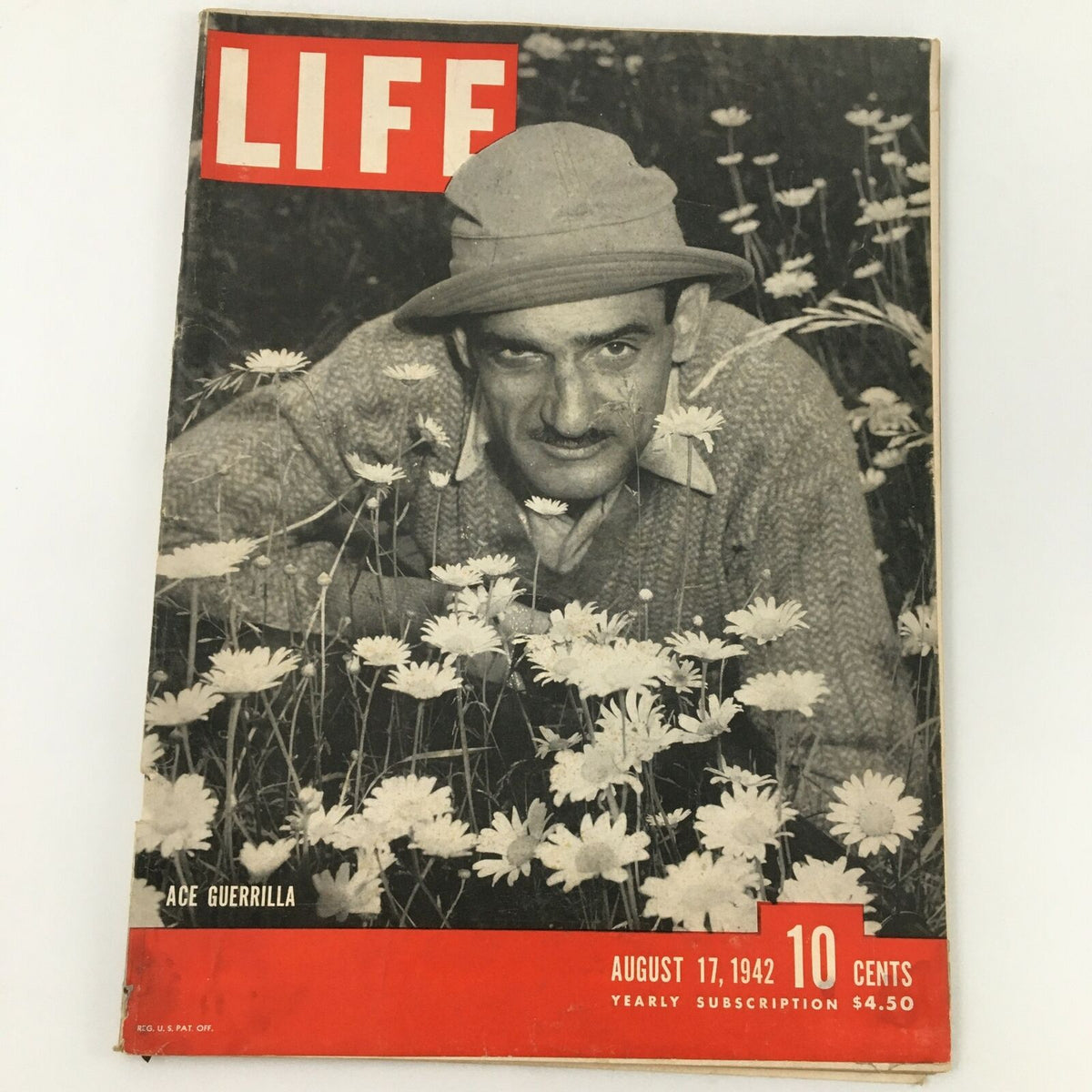 Cover of VTG Life Magazine from August 17, 1942, featuring an ace guerrilla in a field of flowers, highlighting the theme of guerrilla warfare expertise during WWII.