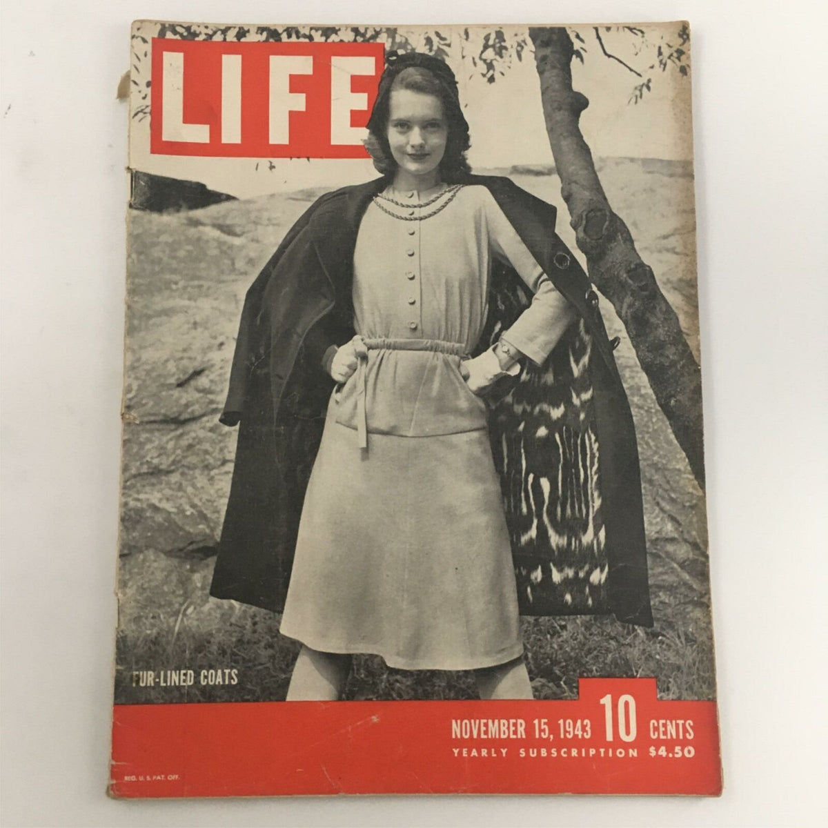 Cover of VTG Life Magazine, November 15, 1943, featuring a model in a fur-lined coat during World War II, reflecting historical fashion trends.