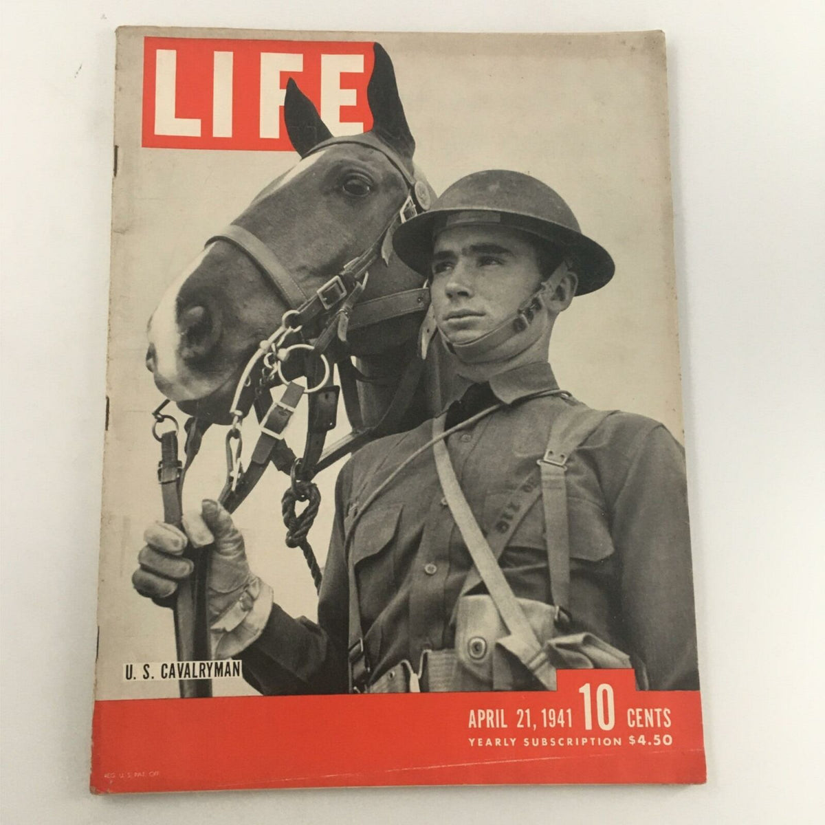 Cover of VTG Life Magazine from April 21, 1941 featuring US Cavalryman Private Buster Hobbs, showcasing a soldier in uniform beside a horse, a historical snapshot of military life just before World War II.