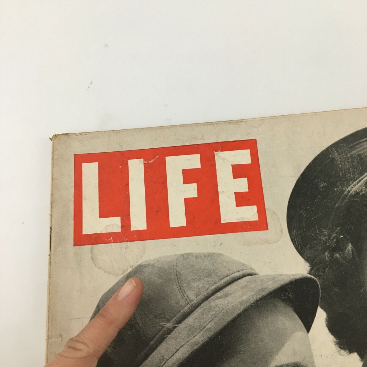 Close-up of the cover of VTG Life Magazine August 24 1942 featuring bold red and white 'LIFE' lettering and a finger pointing at the cover.