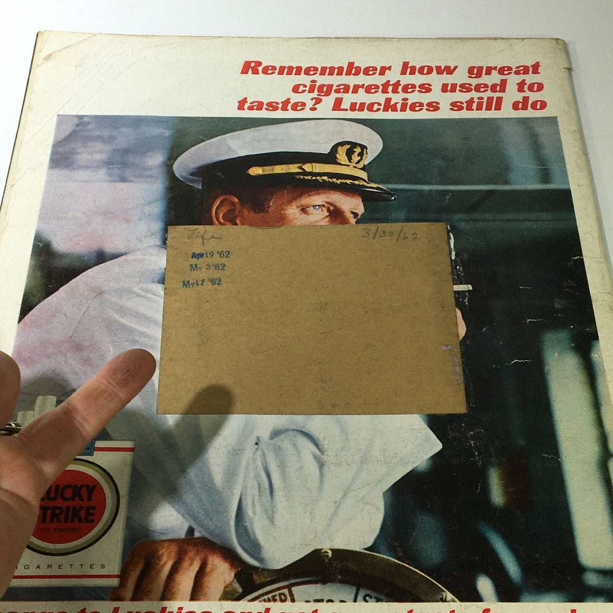 Cover of VTG Life Magazine March 30 1962 featuring an advertisement for Lucky Strike cigarettes and handwritten dates, highlighting the historical context of the era.