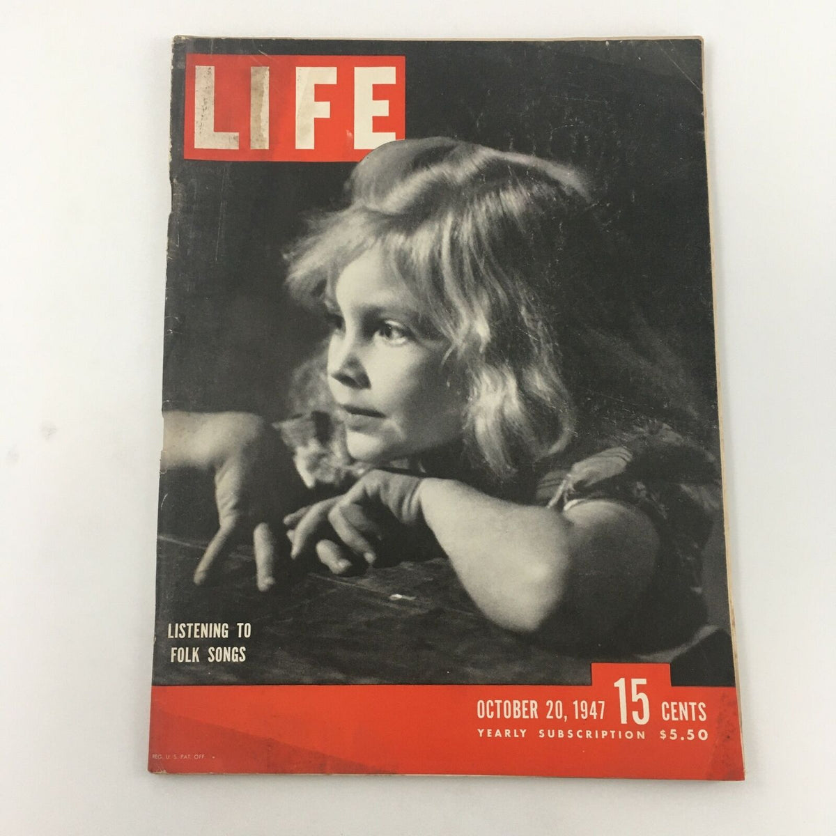 Cover of VTG Life Magazine from October 20, 1947, featuring a young girl listening to folk songs.