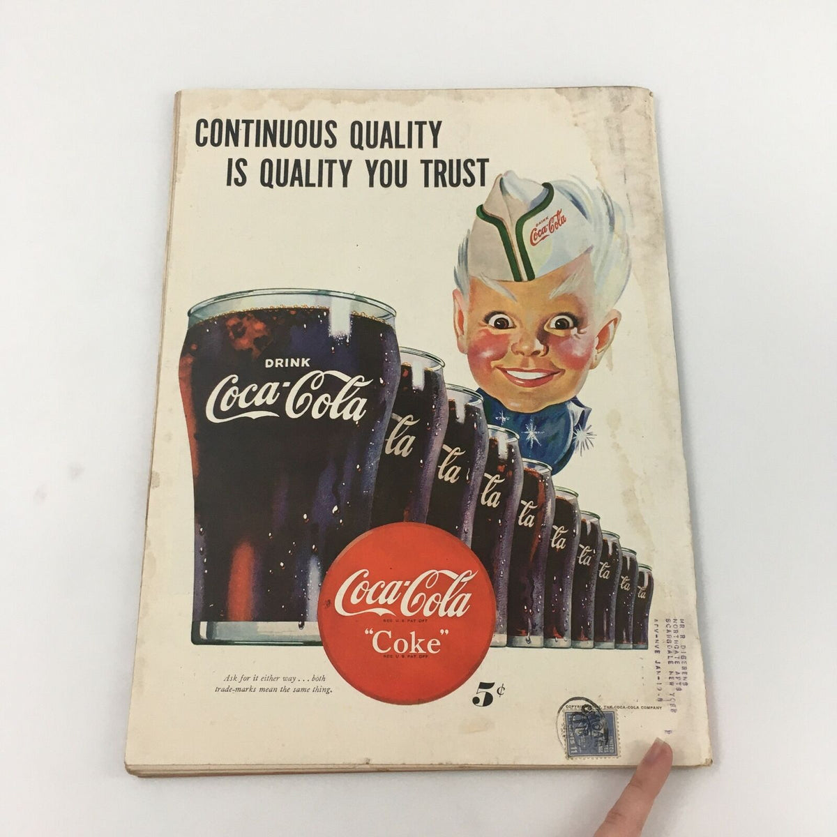 Back cover of vintage Life Magazine illustrating a nostalgic Coca-Cola advertisement with a smiling child.