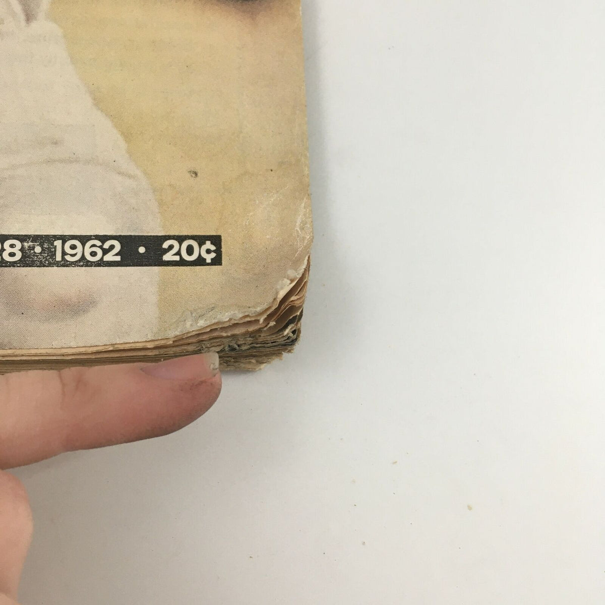 Close-up view of the edges of the VTG Life Magazine, September 28, 1962, highlighting minor wear and condition notes, emphasizing its vintage appeal.