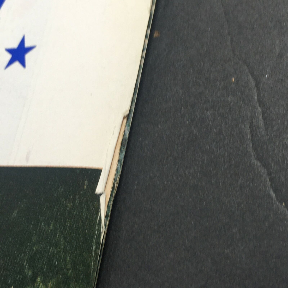 Close-up view of the edge of the VTG Life Magazine from July 4, 1970, highlighting slight damage and wear with colorful imagery, indicative of its historical significance.