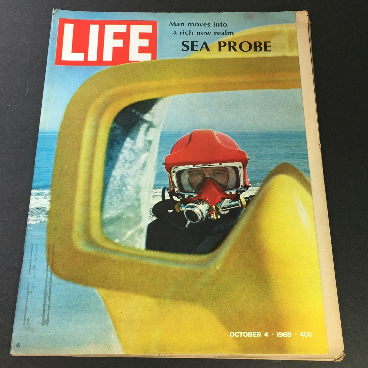 Cover of VTG Life Magazine from October 4, 1968, featuring the headline 'Man Moves Into A Rich New Realm Sea Probe' and an image of a diver in a red helmet looking through a yellow frame, showcasing the theme of underwater exploration.