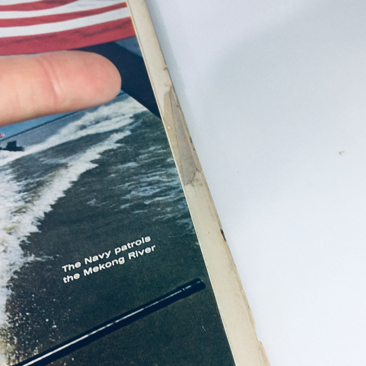 Close-up of the spine of the VTG Life Magazine January 13, 1967, showing wear and the highlighted text 'The Navy patrols the Mekong River'.