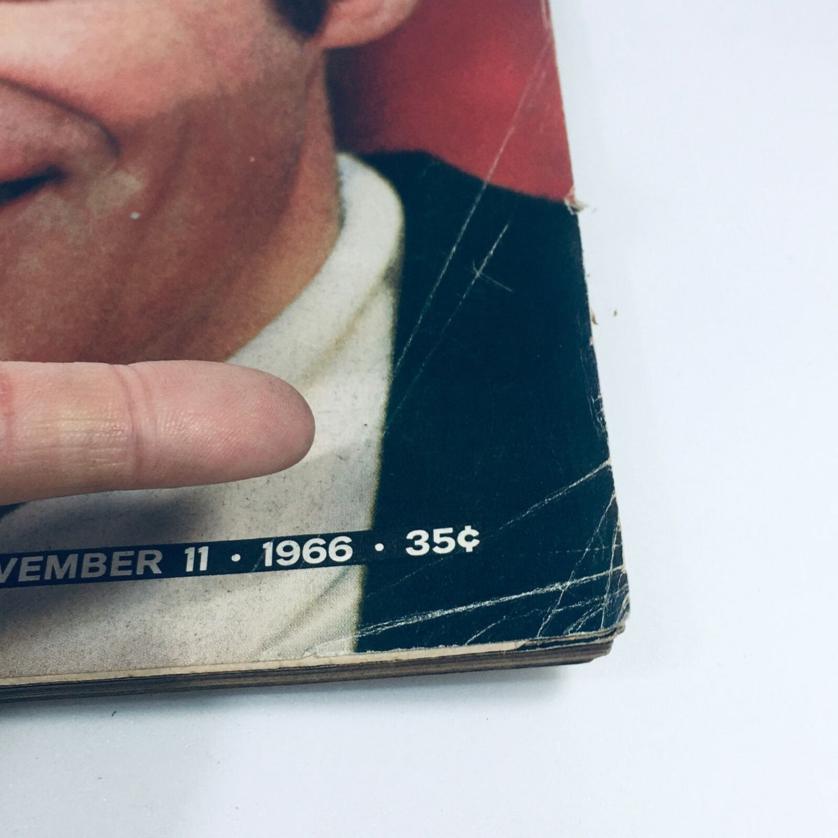 Close-up view of the edge of the VTG Life Magazine from November 11, 1966 highlighting the publication date and price, showing wear and character of the vintage item.