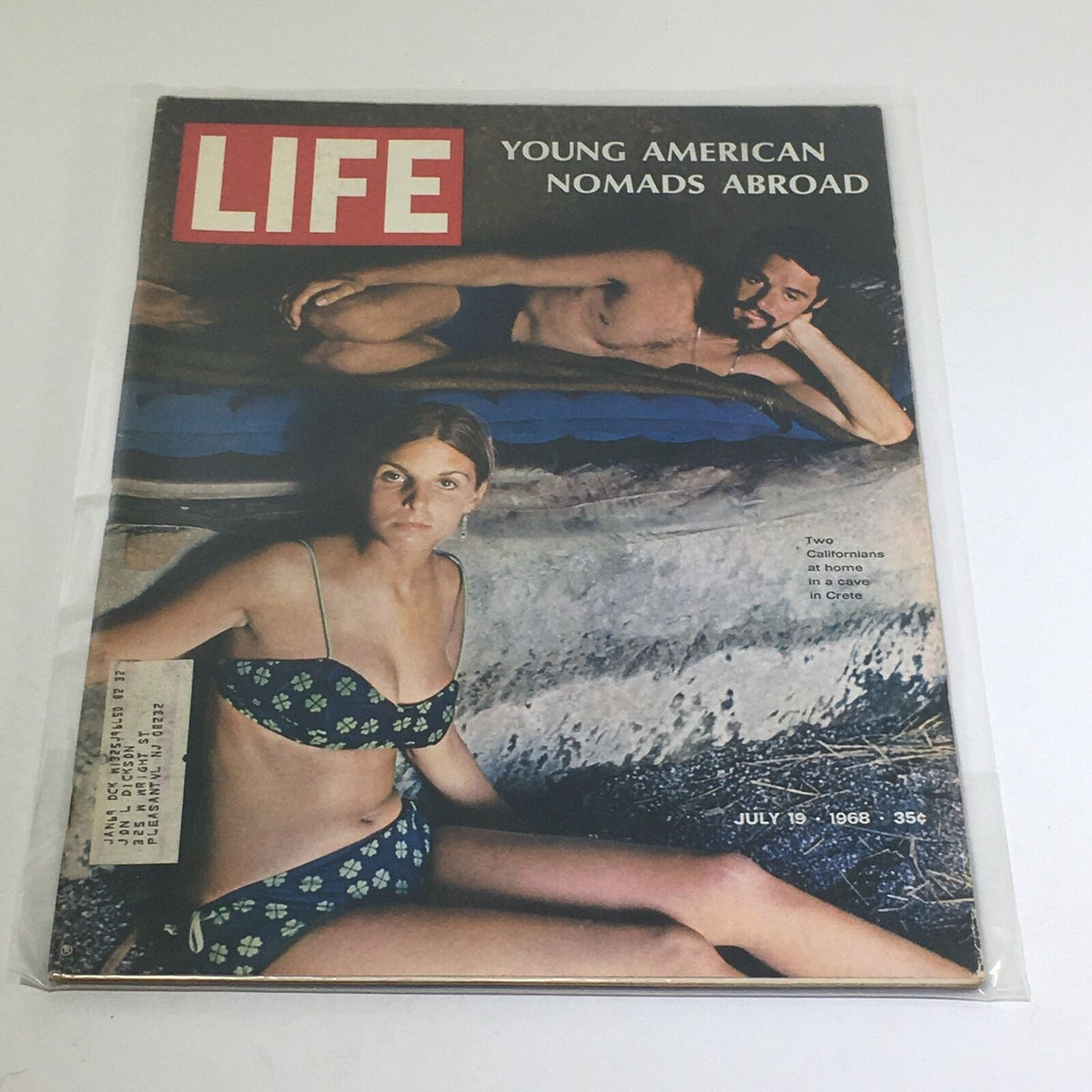 Cover of VTG Life Magazine from July 19, 1968, featuring a captivating image of a young woman in a bikini and a young man lounging, illustrating the theme 'Young Americans Nomads Abroad.' The magazine reflects the cultural shifts of the 1960s, emphasizing adventure and exploration.