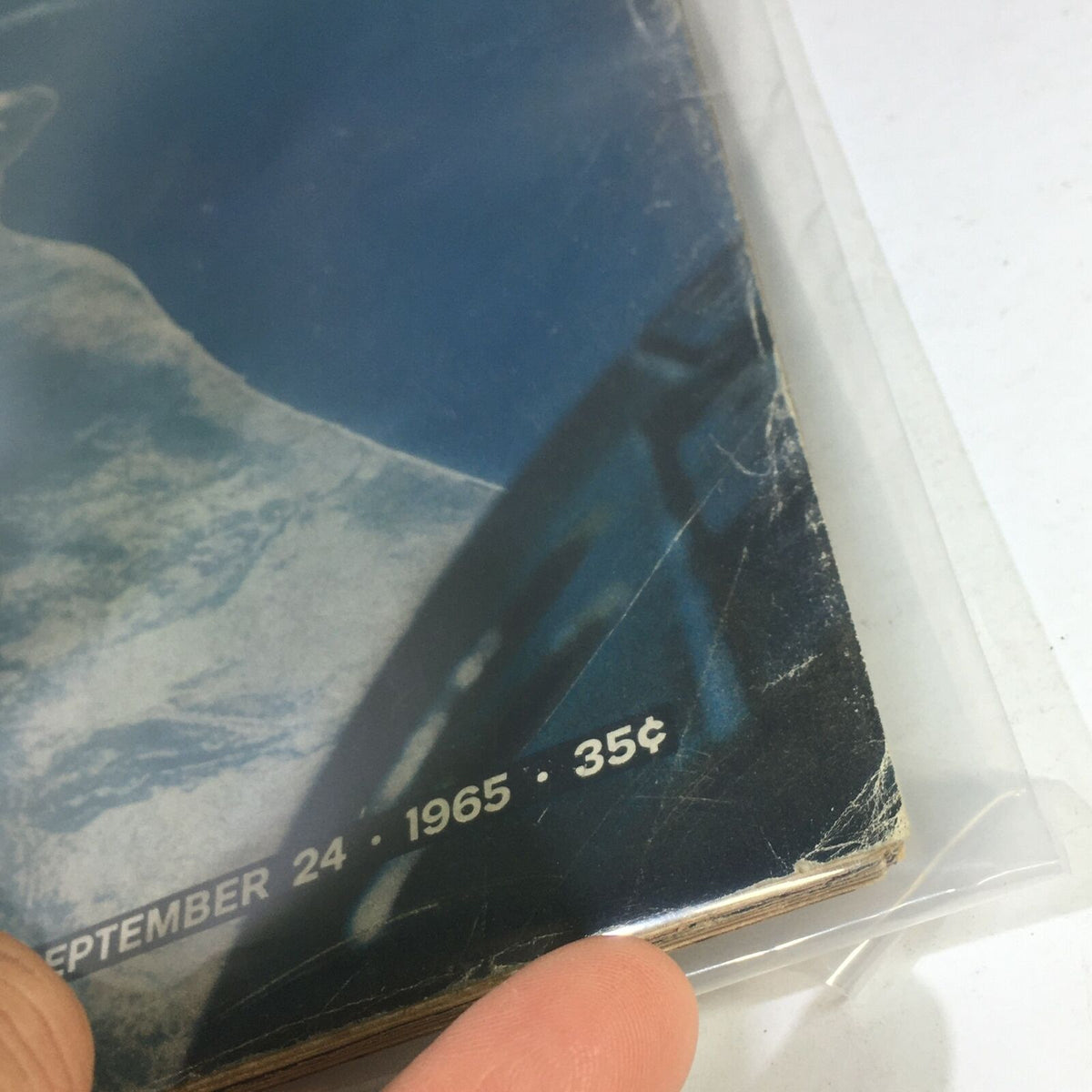 Close-up image of the cover of VTG Life Magazine dated September 24, 1965, displaying the iconic title and date along with the description of remarkable views from the Gemini 5 mission. The photo shows wear indicative of its vintage condition.