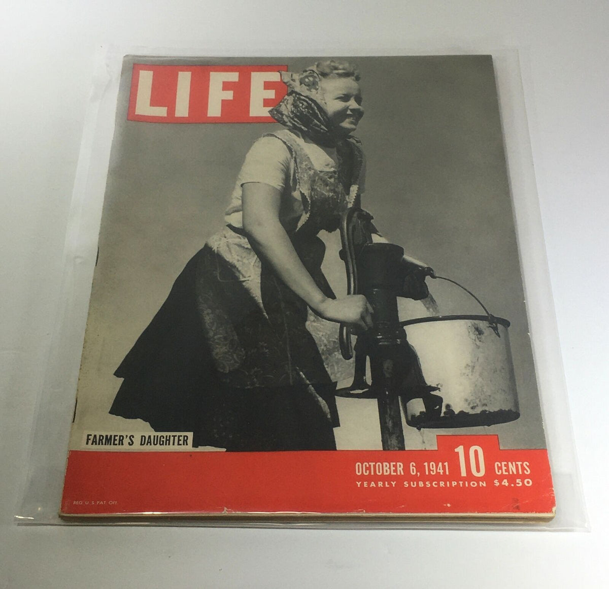 Vintage Life Magazine cover from October 6, 1941, featuring the Farmer's Daughter. The cover displays retro advertising and a historic design aesthetic, showcasing rural life themes.