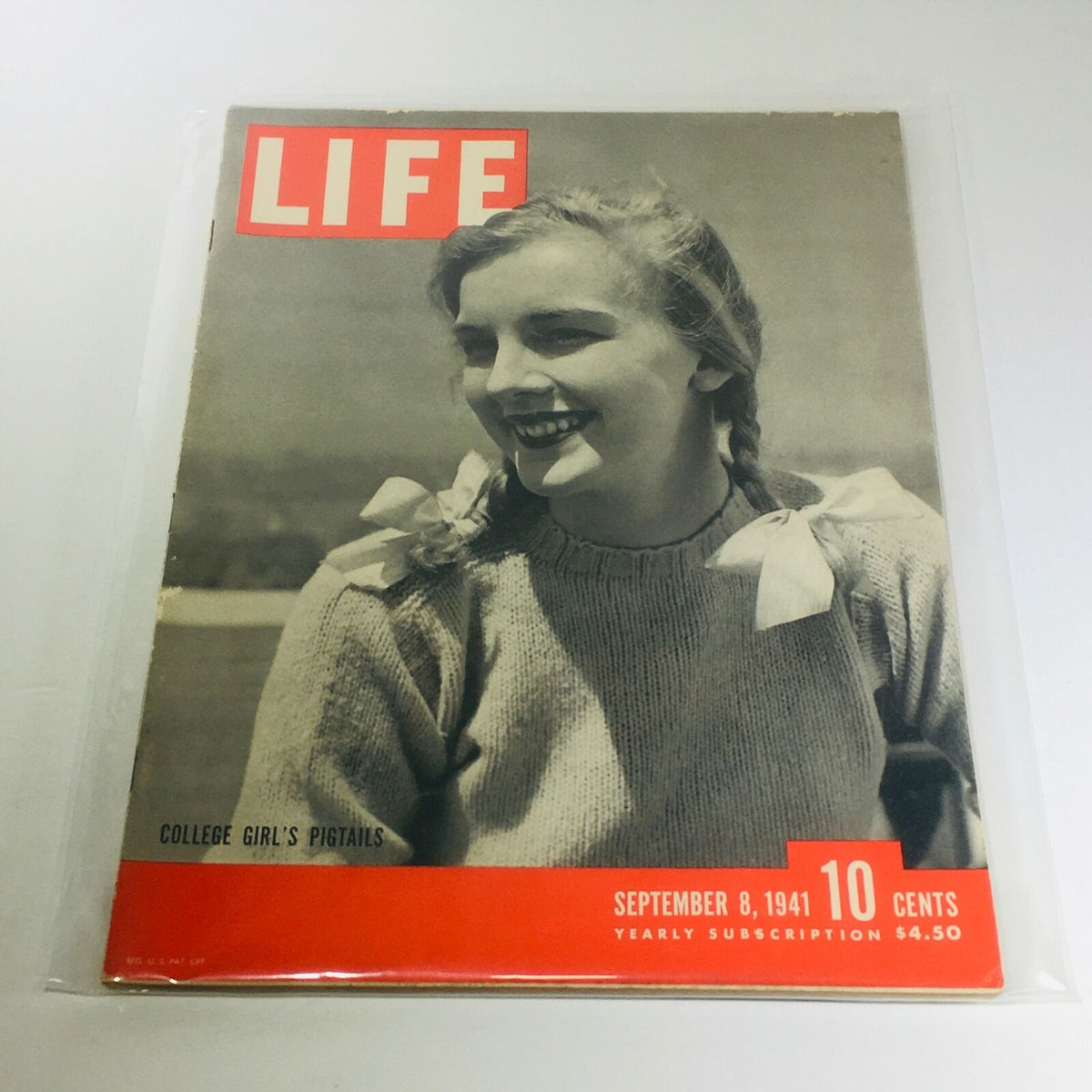 Cover of Vintage Life Magazine from September 8, 1941, featuring a smiling college girl with pigtails and a playful ambiance, emphasizing retro charm and nostalgic appeal.