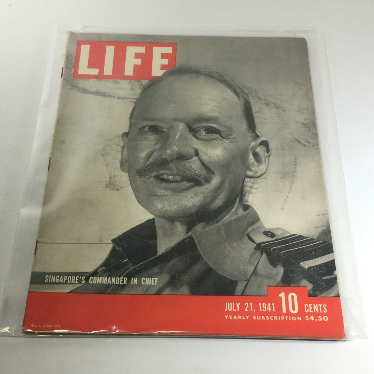 Vintage Life Magazine Cover from July 21, 1941, featuring 'Singapore's Commander In Chief'. The cover showcases a portrait of a smiling military leader against a historical map backdrop. This collectible magazine highlights significant moments and cultural insights of the early 1940s.