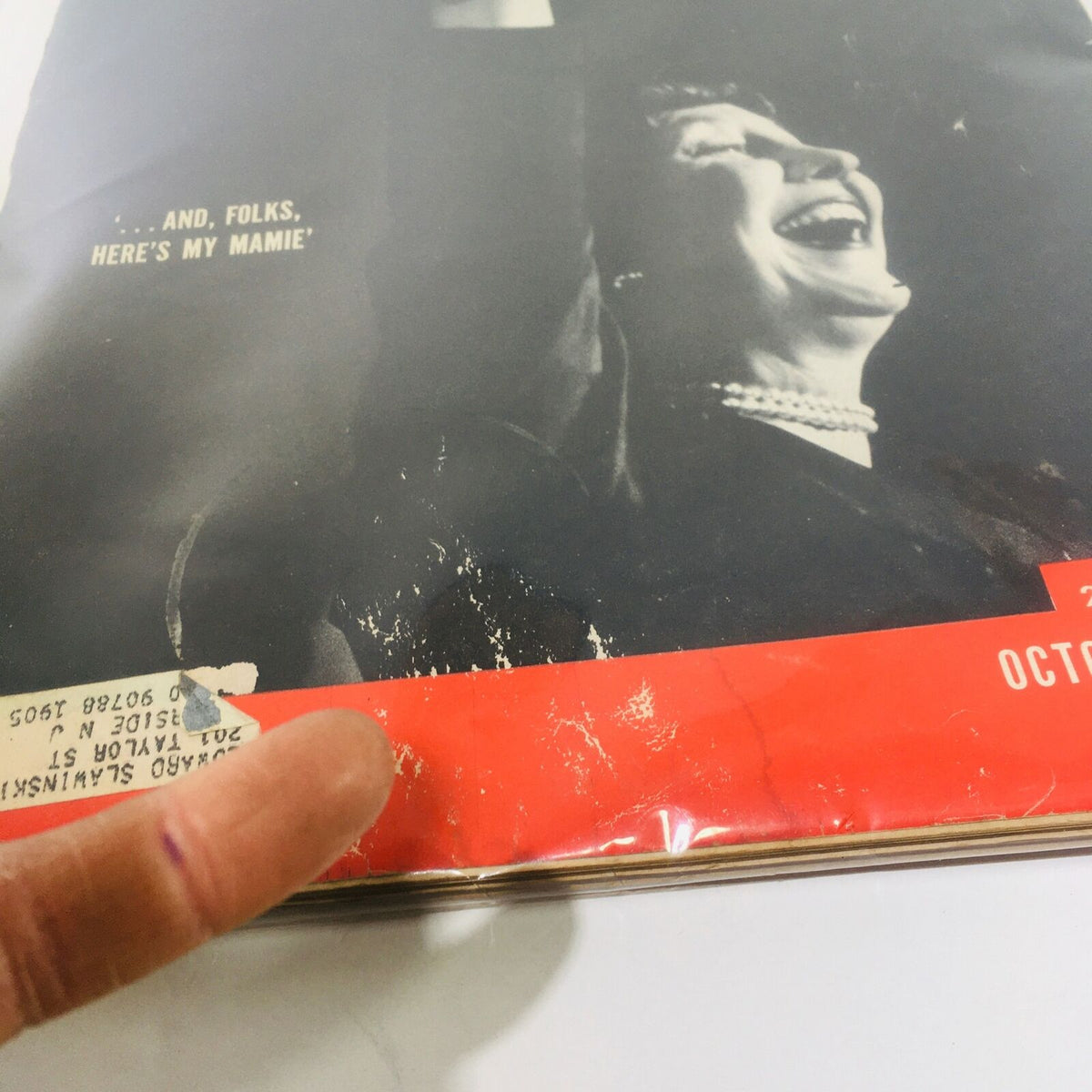 Close-up of the cover of VTG Life Magazine: Oct 13 1952, highlighting the wear and age on the magazine's edges. The cover features Mamie Eisenhower and includes an address label and signs of use.