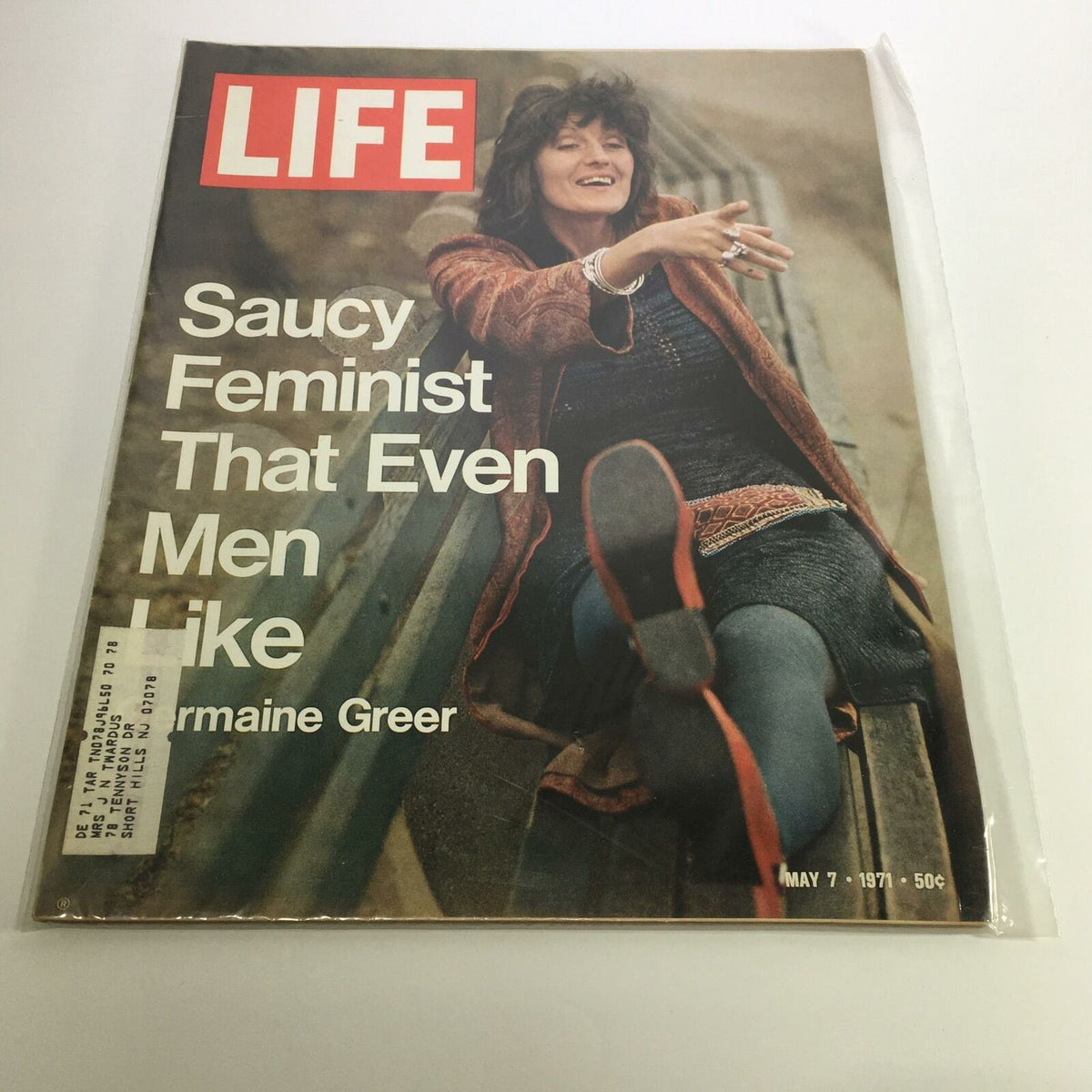 Cover of Life Magazine dated May 7, 1971, featuring the title 'Saucy Feminist That Even Men Like' along with an image of a woman smiling and dressed in a colorful outfit. This issue includes discussions on feminist themes and cultural commentary relevant to the era.