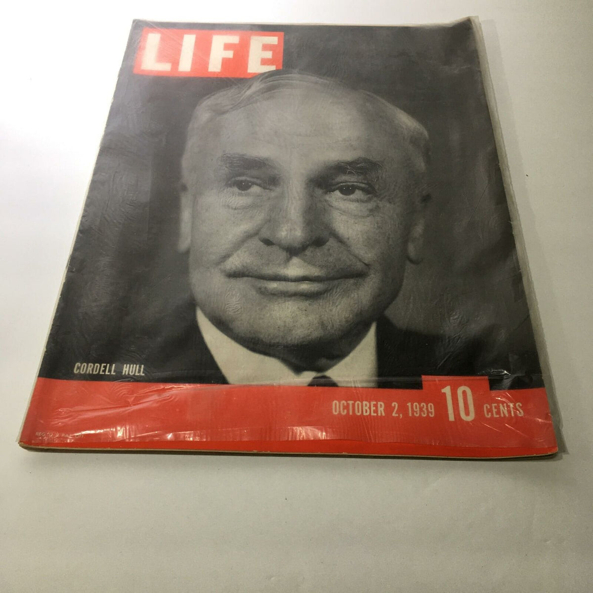 Cover of Life Magazine: October 2, 1939 featuring Cordell Hull, showcasing a vintage design with a monochromatic portrait and bold red accents.