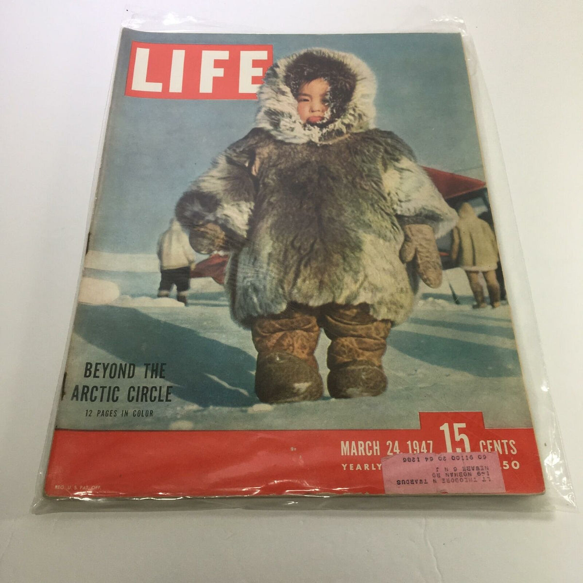 Life Magazine cover from March 24, 1947 titled 'Beyond The Circle'. The cover features a child dressed in a fur coat, adapting to a cold Arctic environment. This vintage magazine reflects the cultural ambiance of post-war America, showcasing significant historical moments and personalities.