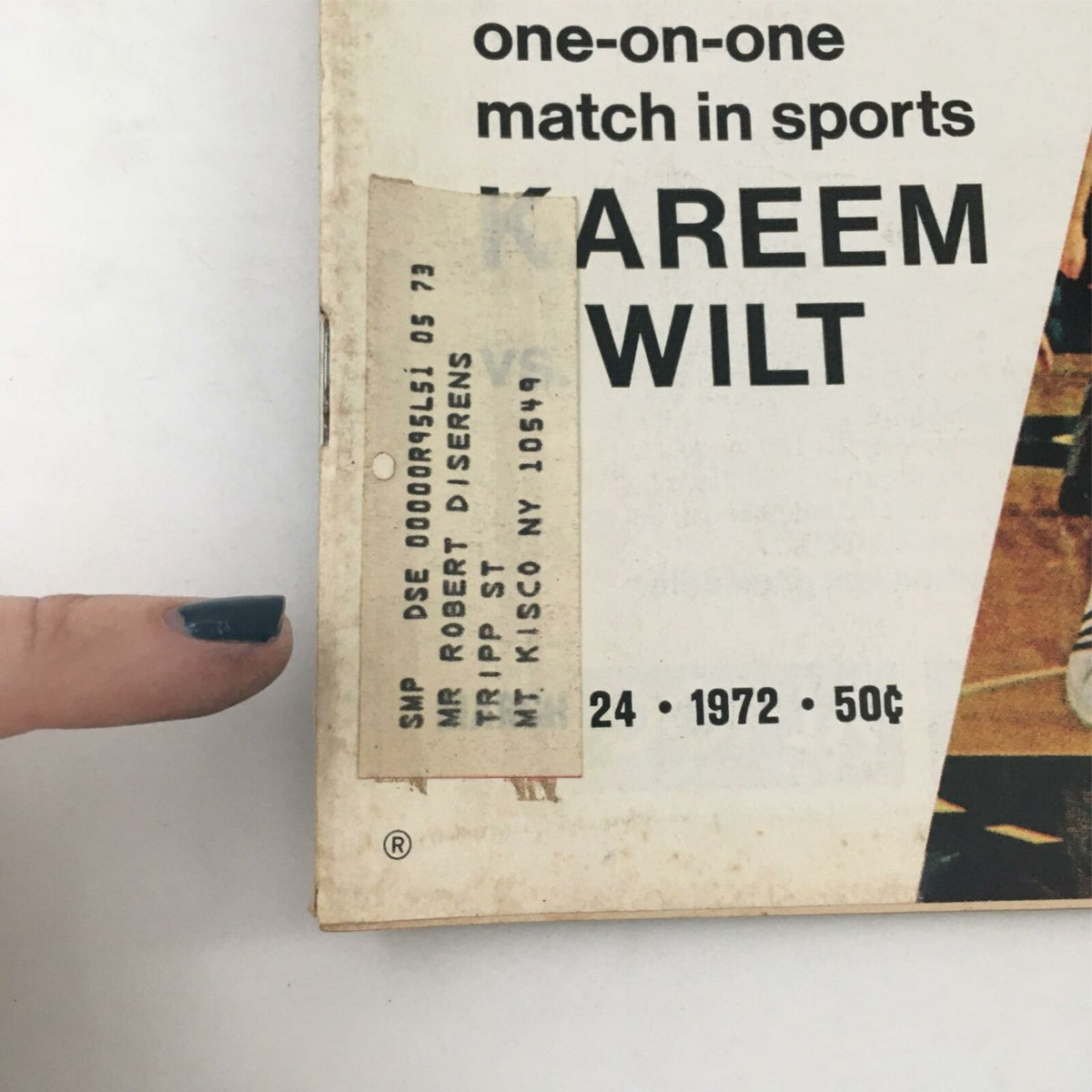 Close-up view of the cover of VTG Life Magazine dated March 24, 1972, featuring a price of 50 cents and a label with an address, related to the article about the Nixon administration and the sports showdown between Kareem Abdul-Jabbar and Wilt Chamberlain.