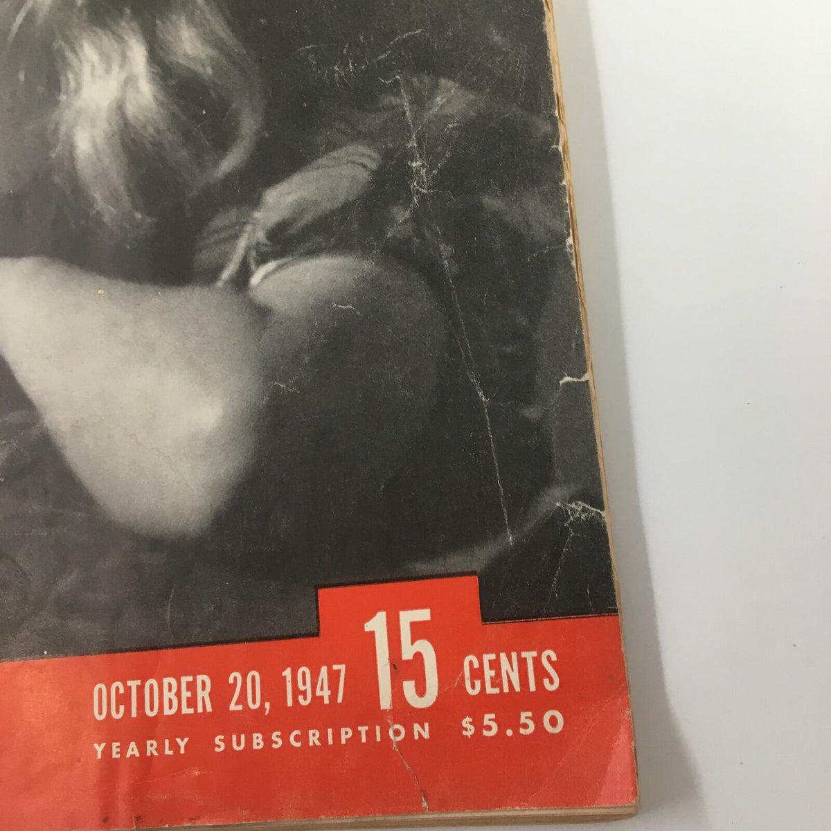 Close-up of the cover of VTG Life Magazine October 20, 1947, highlighting the date and price, featuring a little girl listening to folk songs.