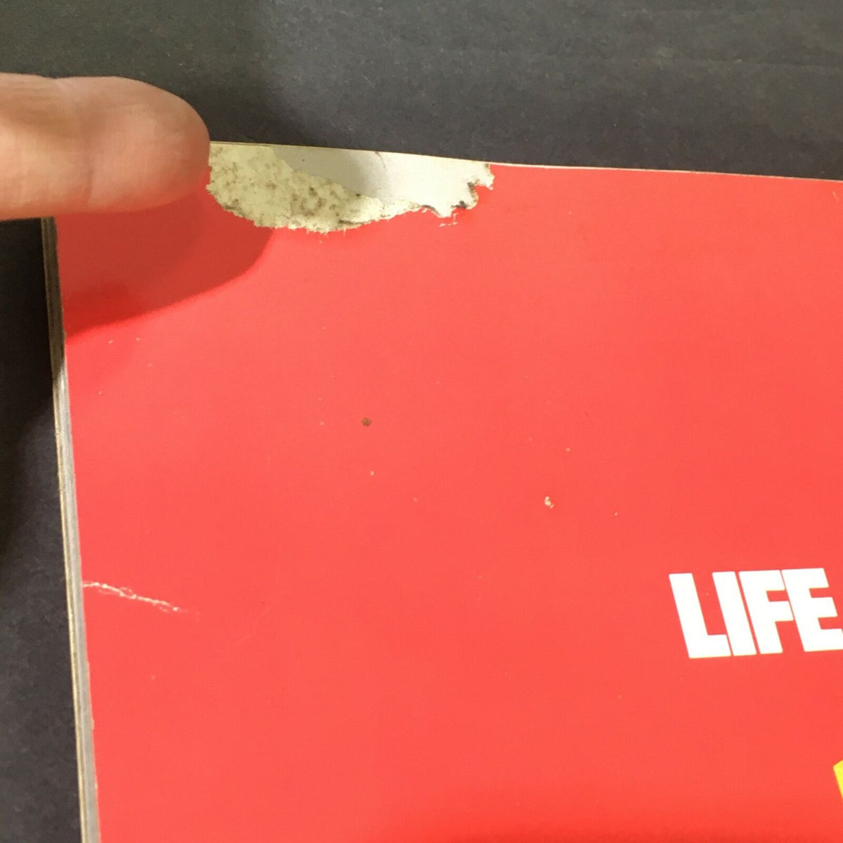 Close-up view of the vintage Life Magazine September 1986 anniversary issue showing minor wear and tear on the cover, highlighting its historical significance for collectors.