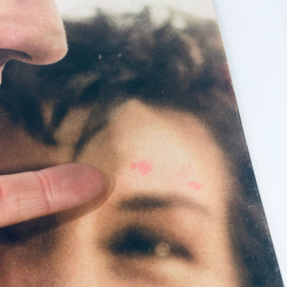 Detailed view of the VTG Life Magazine May 31 1963 cover showing minor surface blemishes and a finger pointing at a pink mark on the surface.