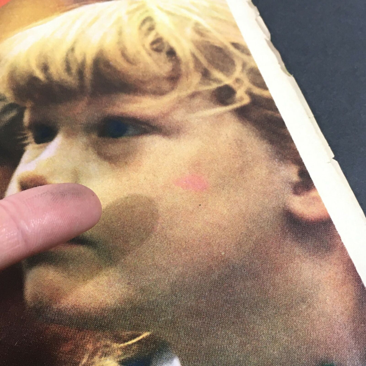 Detail of a child's face on the cover of VTG Life Magazine from September 19, 1969, with minor marking on the surface.