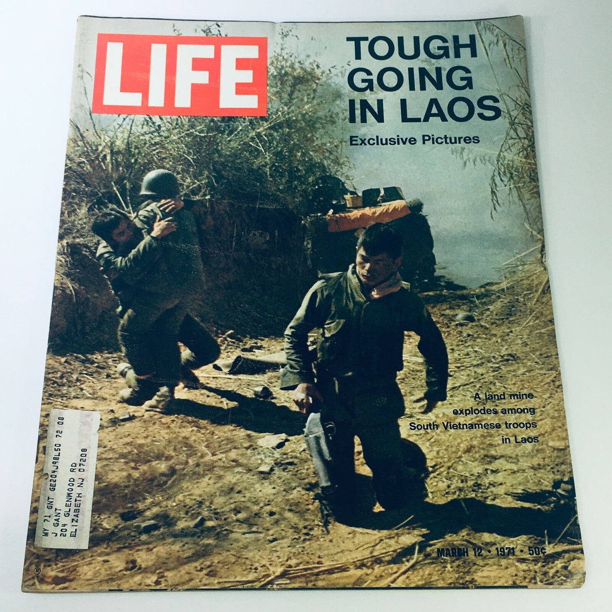 Cover of VTG Life Magazine March 12, 1971 featuring the title 'Tough Going in Laos' with a dramatic photograph of South Vietnamese troops and a reference to a land mine explosion.