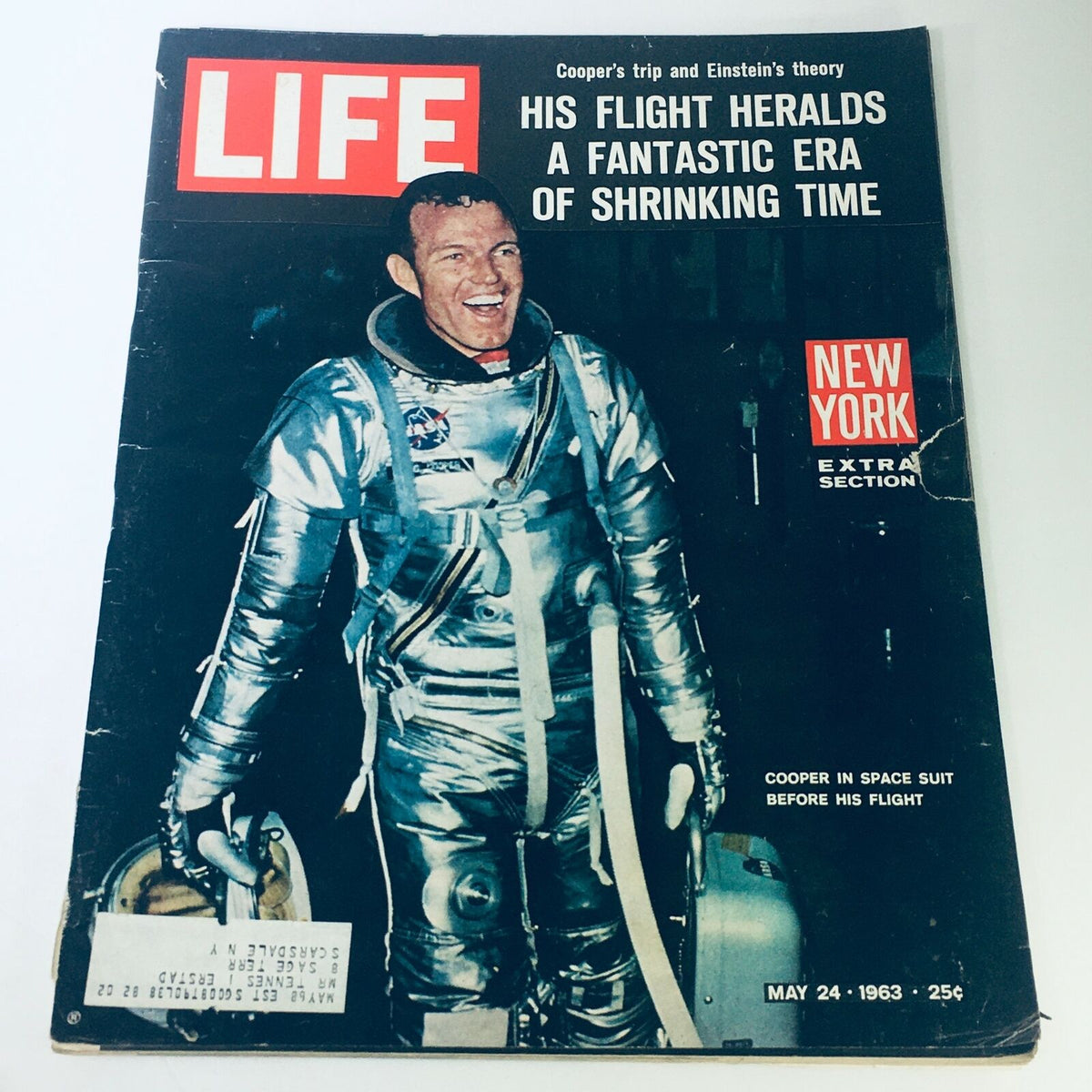 Vintage Life Magazine cover from May 24, 1963, featuring Gordon Cooper in his space suit, highlighting his flight and insights into Einstein's theory. Perfect for collectors of space and science history.