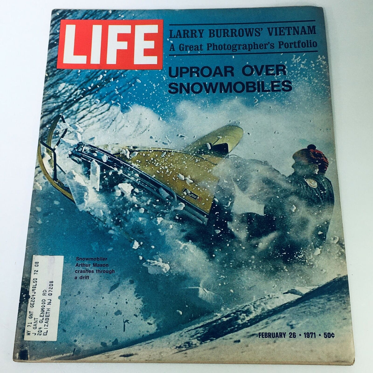 Cover of VTG Life Magazine February 26 1971 featuring snowmobiler Arthur Mason crashing through snow. The magazine highlights the thrill of snowmobiling with photography by Larry Burrow.