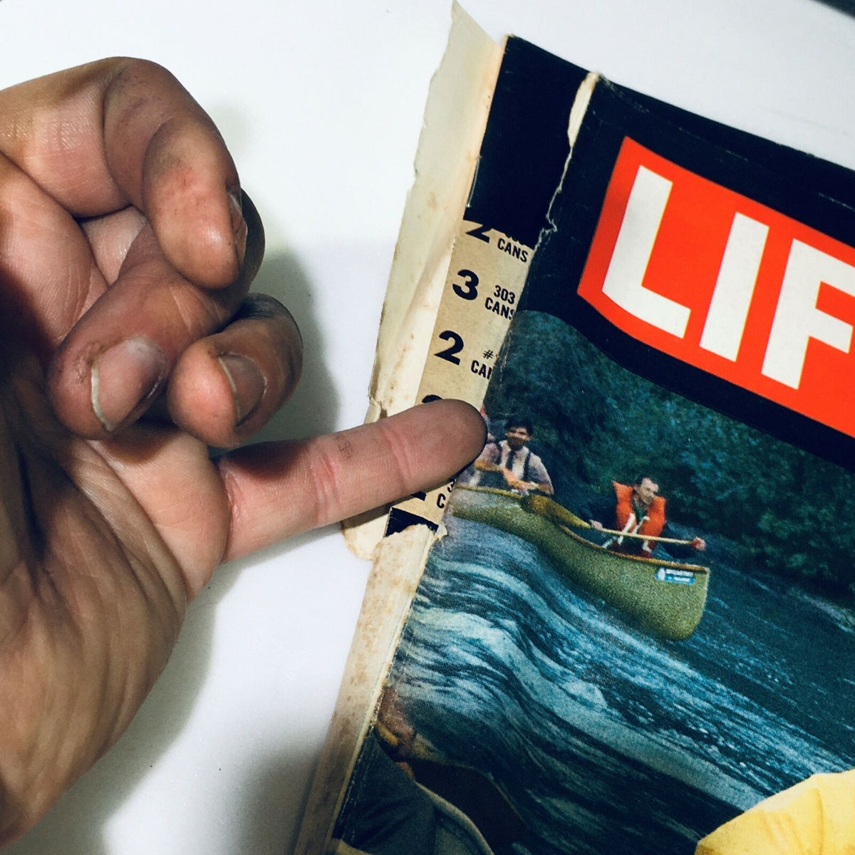 Close-up view of the VTG Life Magazine June 7 1968 cover, featuring 'The Voyage of The Loner' with a hand pointing to the magazine's spine. Shows minor wear and vintage character.