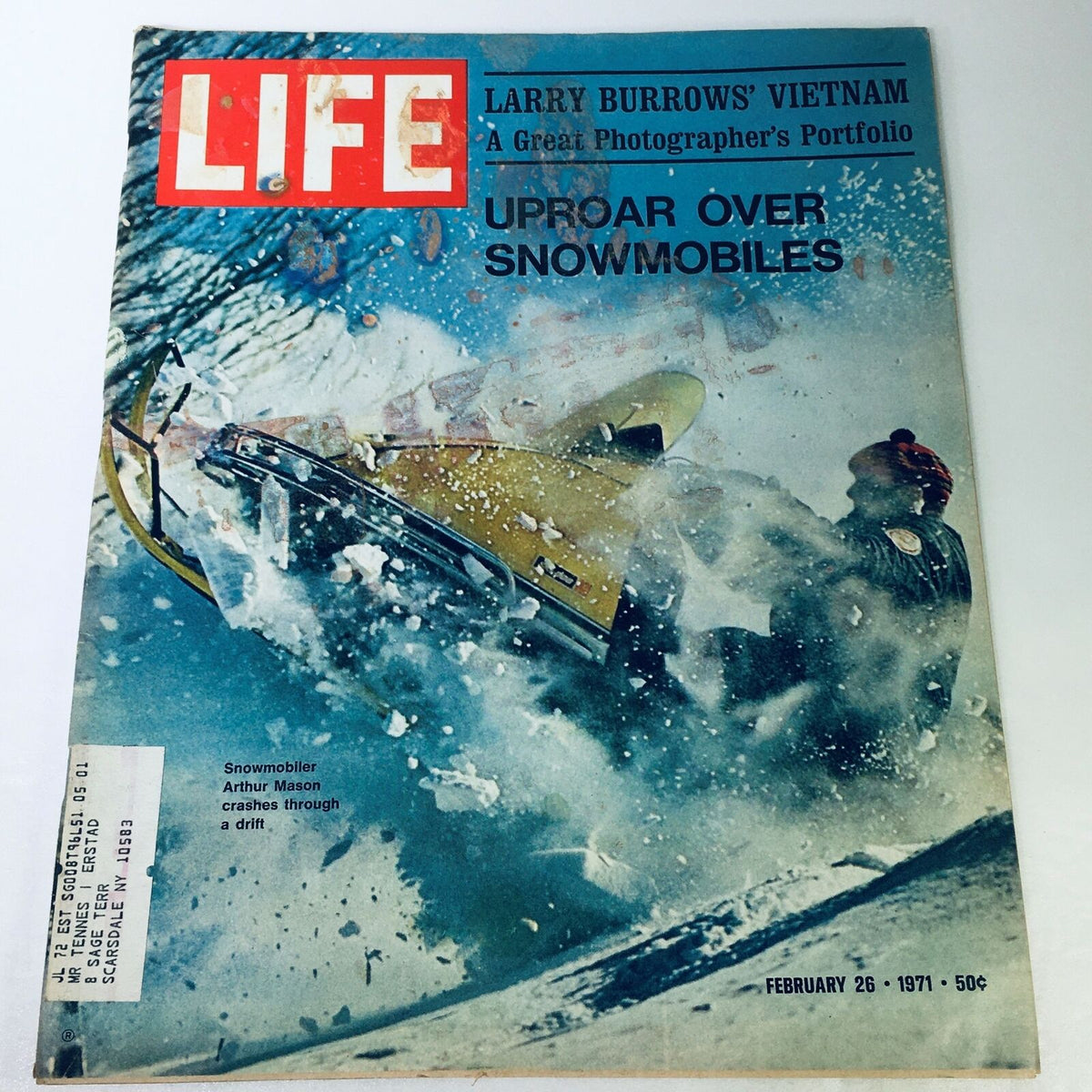 Cover of VTG Life Magazine February 26 1971 featuring snowmobiler Arthur Mason crashing through a snow drift, capturing the thrill of snowmobiling.