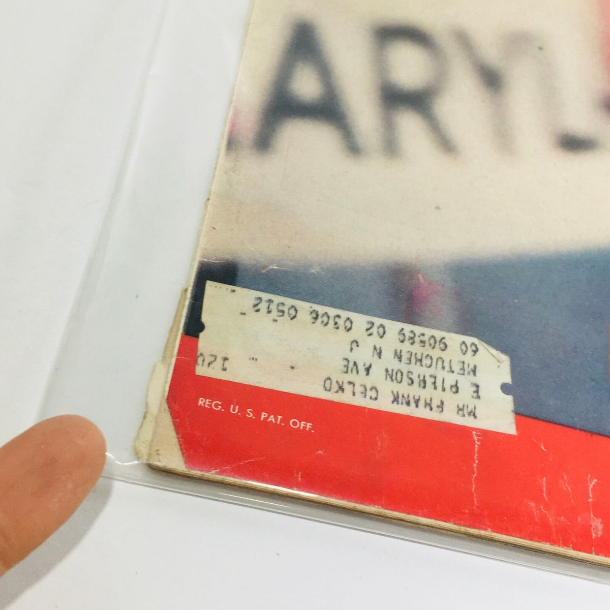 Close-up of the edge of the vintage Life Magazine from August 8, 1960, showing an address label and wear, highlighting its authenticity and vintage character.