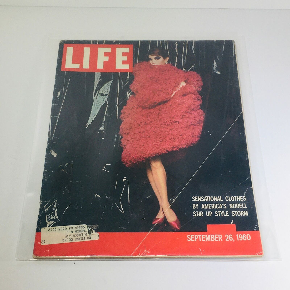 Cover of VTG Life Magazine from September 26, 1960, featuring sensational clothes by Norell, showcasing a model in a bold red fuzzy outfit.