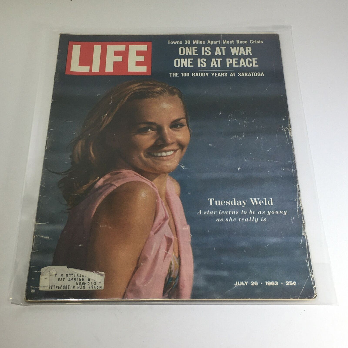 Vintage Life Magazine cover from July 26, 1963 featuring Tuesday Weld, showcasing the theme 'One is at War, One is at Peace'. The magazine highlights cultural aspects of the early 1960s.