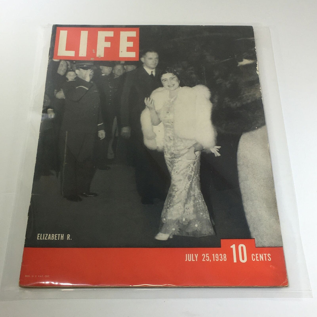 Vintage Life Magazine Cover featuring Elizabeth R. from July 25, 1938, showcasing a glamorous woman in a fur wrap with an evening dress.