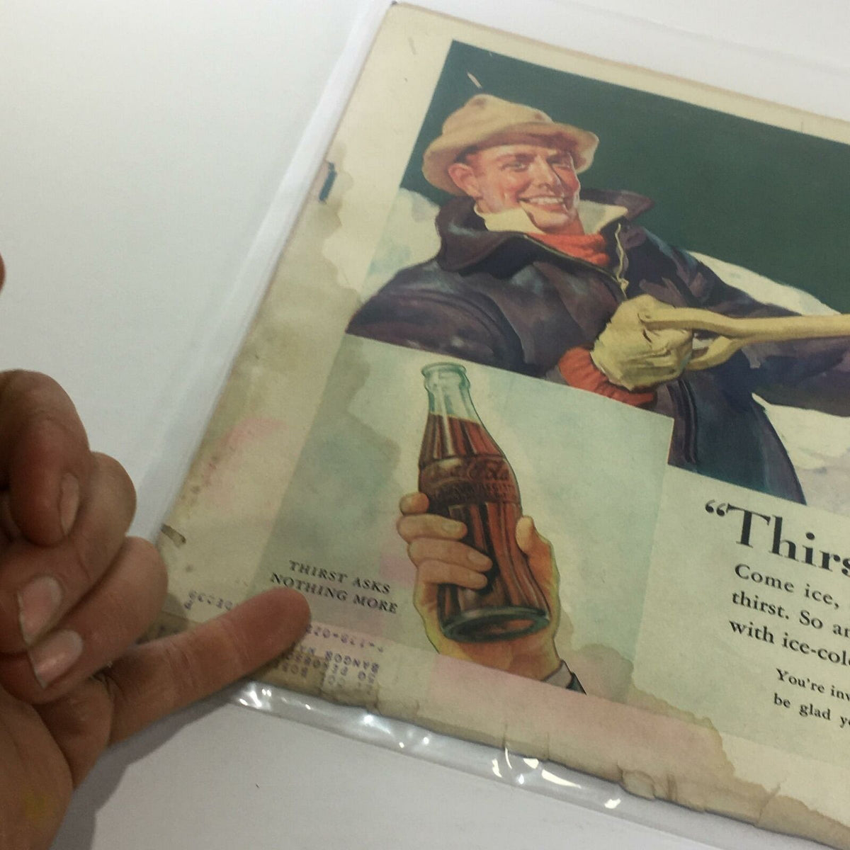 An advertisement page from Vintage Life Magazine, illustrating a smiling man holding a Coca-Cola bottle with the phrase 'THIRST ASKS NOTHING MORE', capturing the nostalgic charm of the era.