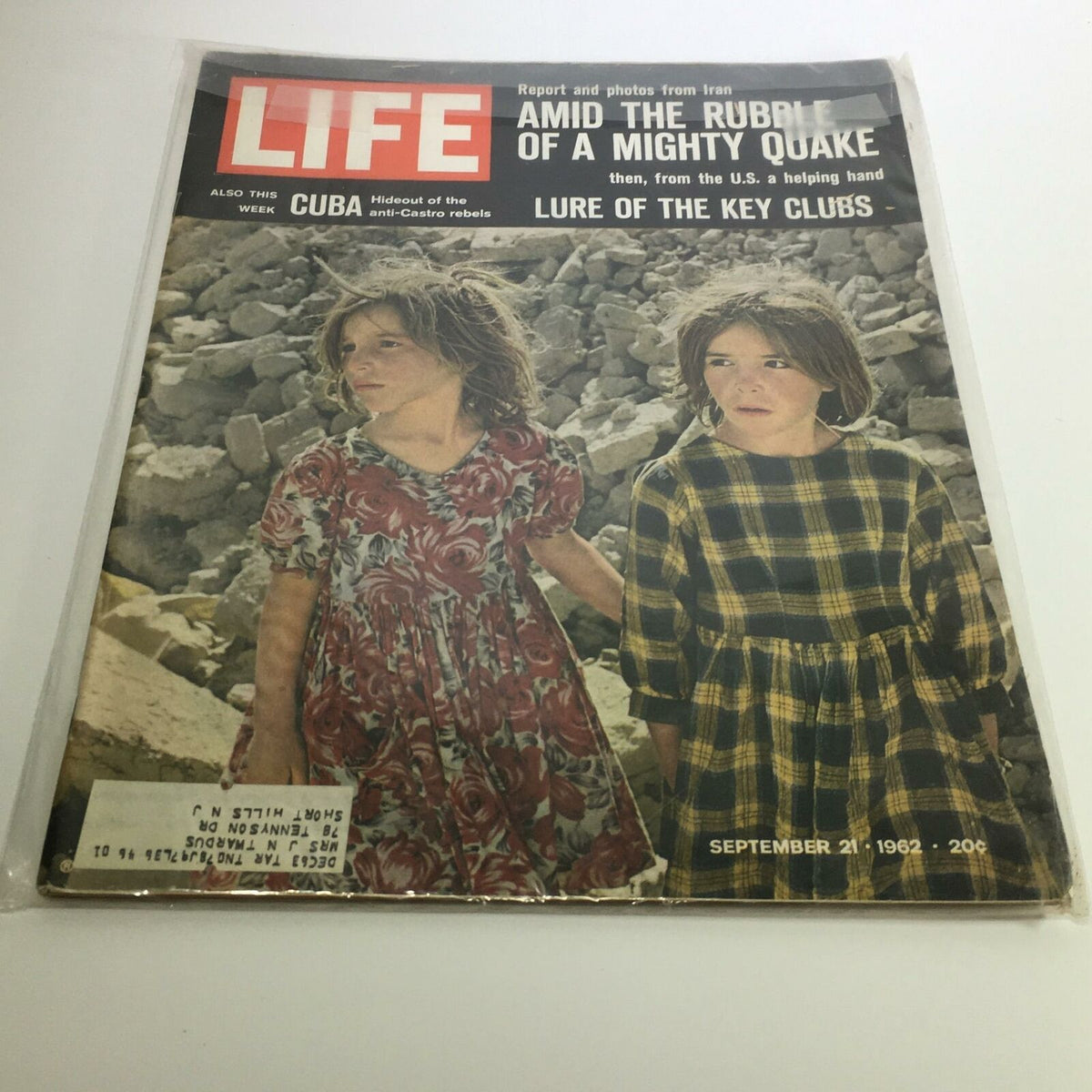 Cover of Life Magazine September 21 1962, featuring the title 'Amid The Rubble of a Mighty Quake in Iran', showcasing two children in front of earthquake debris.