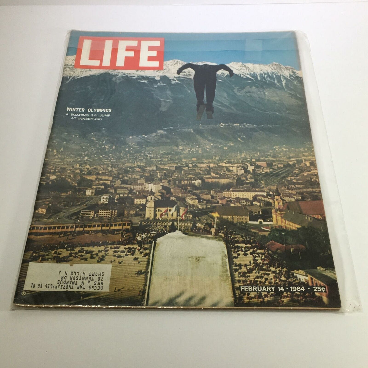 Life Magazine February 14 1964 Winter Olympics Ski Jump at Innsbruck, featuring a breathtaking ski jump athlete soaring above the mountainous landscape of Innsbruck, Austria.