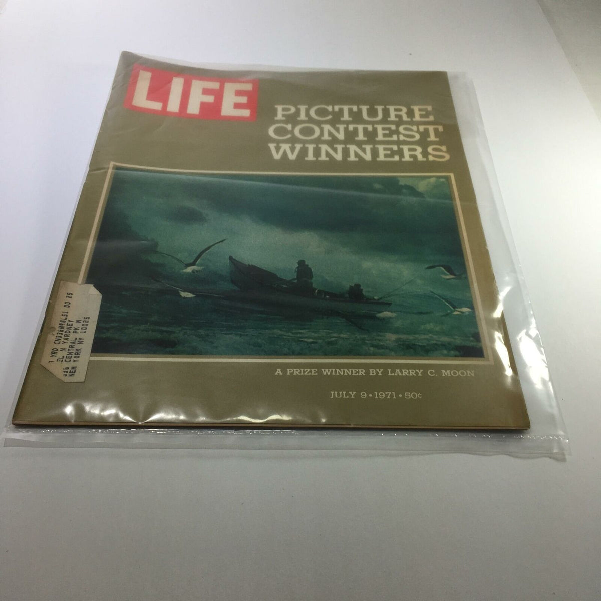 Vintage Life Magazine from July 9, 1971, featuring 'A Prize Winner' by Larry C. Moon. The cover depicts a moody image of a fishing scene with boats and birds, showcasing the nostalgic charm of classic publications. Ideal for collectors and history enthusiasts.