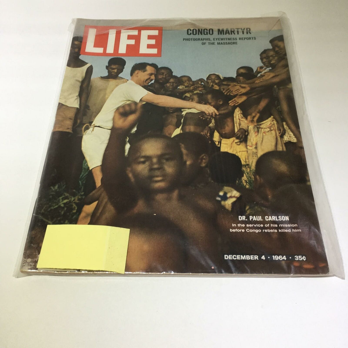 Cover of VTG Life Magazine December 4 1964 featuring Dr. Paul Carlson and the Congolese Massacre, showcasing a poignant historical moment with powerful imagery.