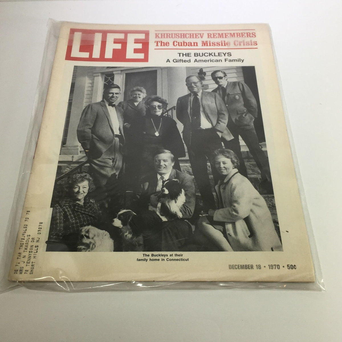Cover of Life Magazine from December 18, 1970, featuring 'The Buckleys - A Gifted American Family'. The image shows the Buckley family gathered at their home in Connecticut, showcasing a mix of adults and children along with dogs, highlighting their familial bonds in a nostalgic setting.