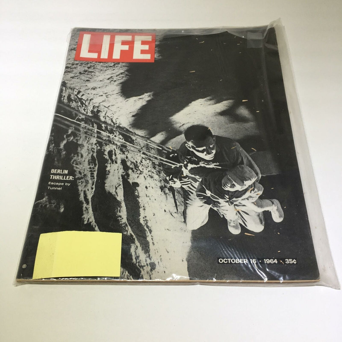 Cover of VTG Life Magazine from October 16, 1964, featuring a striking black and white photograph related to the Freedom Tunnel under the Berlin Wall, showcasing the theme 'Escape by Tunnel.'