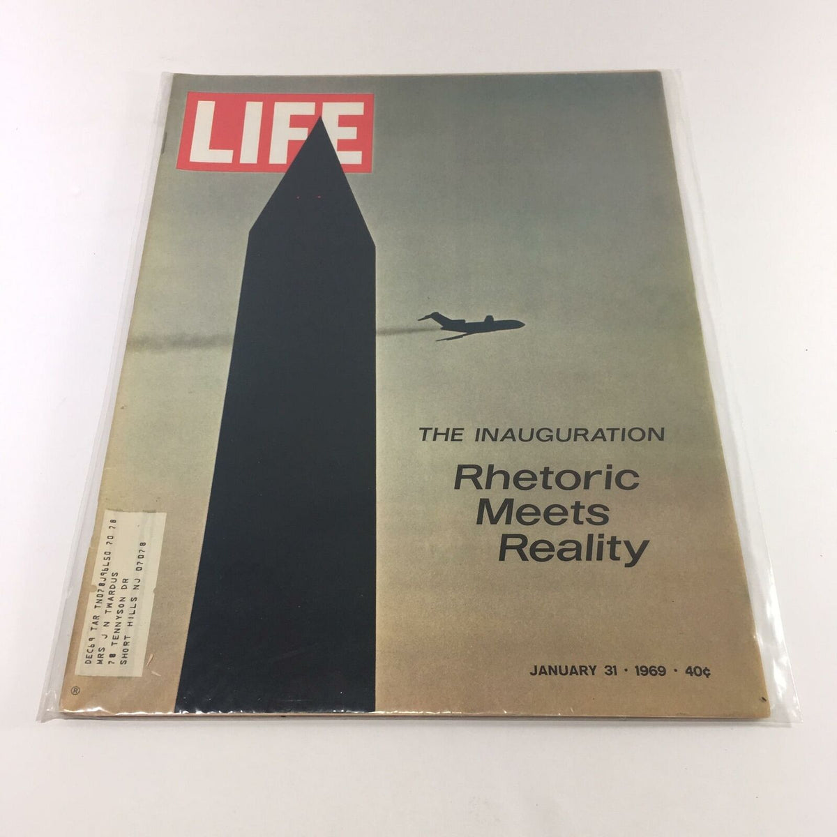 Cover of VTG Life Magazine from January 31, 1969 featuring the inauguration of President Lyndon B. Johnson, with the tagline 'Rhetoric Meets Reality' and an image of an airplane flying over a silhouette of the Washington Monument.