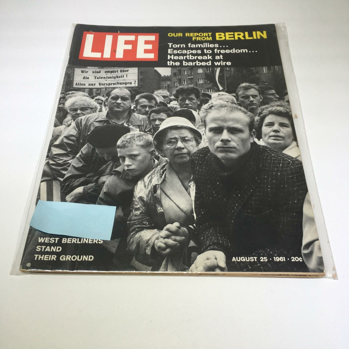 Cover of VTG Life Magazine August 25 1961, featuring the story 'Torn Families Escape To Freedom' with a crowd of people depicted in a poignant scene, highlighting the theme of escape and resilience during a turbulent era.